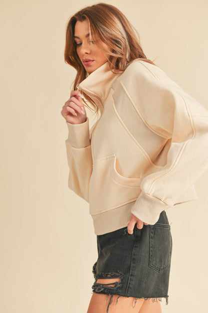 AEMI + CO Dove Funnel Neck Half Zip